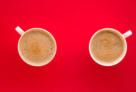 Breakfast, drinks and modern lifestyle concept - Hot aromatic coffee on red background, flatlayの写真素材