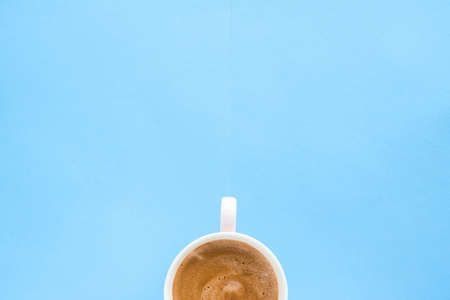 Breakfast, drinks and modern lifestyle concept - Hot aromatic coffee on blue background, flatlay
