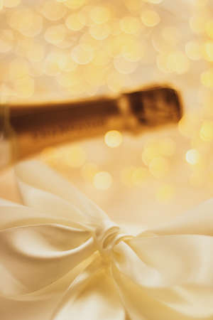 Romantic celebration, lifestyle and luxury present concept - The bottle of champagne and holiday...
