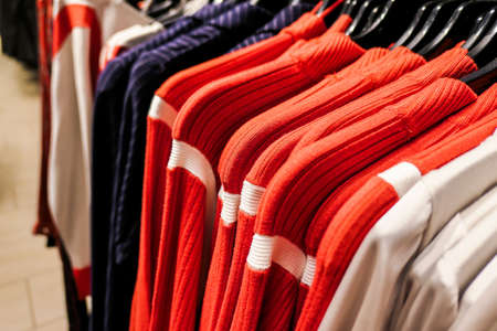 Style, fashion shop and shopping concept - Fashionable casual clothes in a boutique storeの写真素材