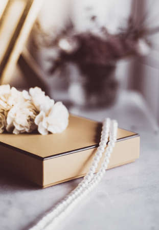 Valentine's day ideas, luxury shopping and holiday inspiration concept - Pearl jewellery in a vintage golden gift boxの写真素材