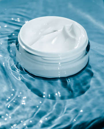 Sensitive skincare moisturizer cream on water background - clean beauty, cosmetic products and luxury body care concept. Natural science for your skinの写真素材