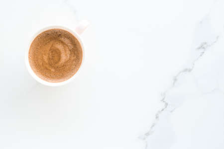 Breakfast, drinks and modern lifestyle concept - Hot aromatic coffee on marble, flatlayの写真素材