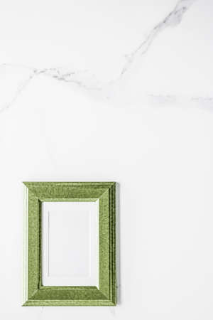 Modern feminine, artwork mock up, luxury design concept. Decorate with chic and style - Green photo frame on marble, flatlayの写真素材