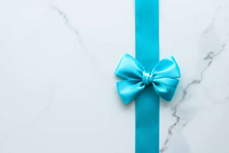 Holiday decor, feminine design and flatlay concept - Blue silk ribbon on marble, top viewの写真素材