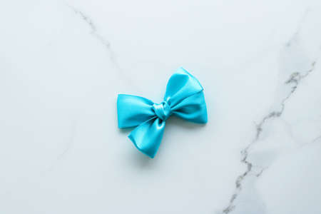 Holiday decor, feminine design and flatlay concept - Blue silk ribbon on marble, top viewの写真素材