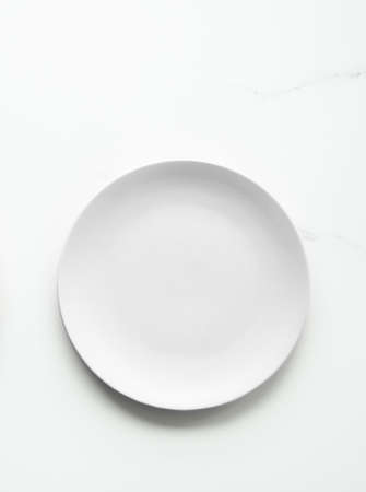 White empty plate on marble, flatlay - stylish tableware, romantic table decor and food menu concept. Serve the perfect dishの写真素材