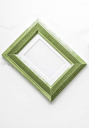 Modern feminine, artwork mock up, luxury design concept. Decorate with chic and style - Green photo frame on marble, flatlayの写真素材