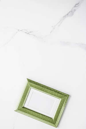 Modern feminine, artwork mock up, luxury design concept. Decorate with chic and style - Green photo frame on marble, flatlayの写真素材