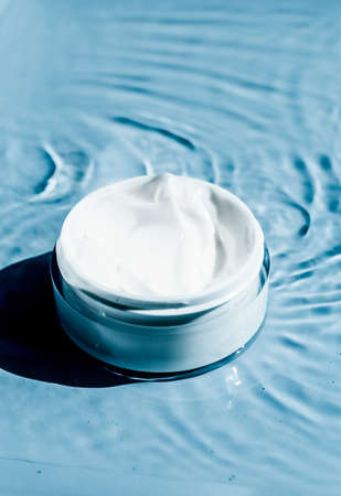 Sensitive skincare moisturizer cream on water background - clean beauty, cosmetic products and luxury body care concept. Natural science for your skinの写真素材