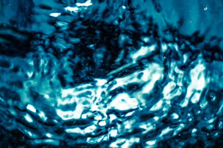 Abstract blue liquid surface as background - futuristic design and science concept. Deep blue watersの写真素材