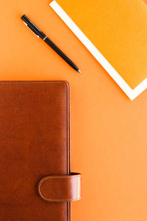 Modern workspace, productivity and corporate lifestyle concept - Luxury business brown brief-case on the office table desk, flatlayの写真素材