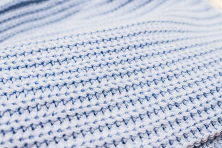 Knitwear, fabric textures and rustic lifestyle concept - Knitted winter clothes