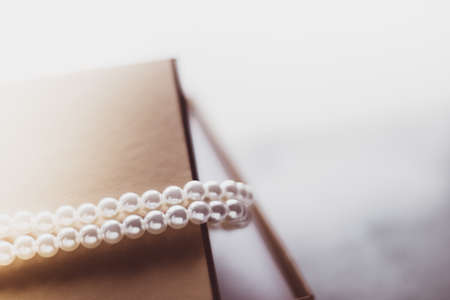 Valentine's day ideas, luxury shopping and holiday inspiration concept - Pearl jewellery in a vintage golden gift boxの写真素材