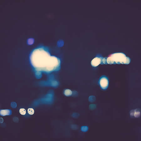 Big metropolitan city lights at night, blurry background - night life, abstract background and...