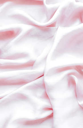 Elegant fabric texture, abstract backdrop and modern pastel colours concept - Pink soft silk waves,...