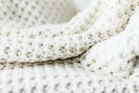 Knitwear, fabric textures and handmade items concept - Warm knitted clothes, soft and whiteの写真素材