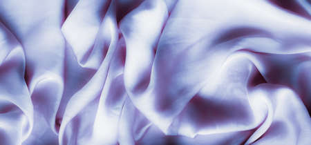 Elegant fabric texture, abstract backdrop and modern pastel colours concept - Purple soft silk waves, flatlay backgroundの写真素材