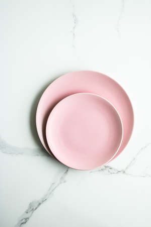 Pink empty plate on marble, flatlay - stylish tableware, table decor and food menu concept. Serve...