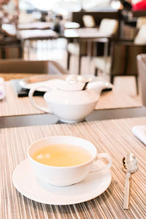 Healthy nutrition, relax and detox concept - Green herbal tea in a restaurant, five o'clockの写真素材