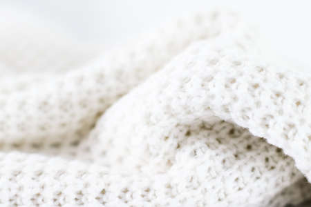 Knitwear, fabric textures and handmade items concept - Warm knitted clothes, soft and whiteの写真素材