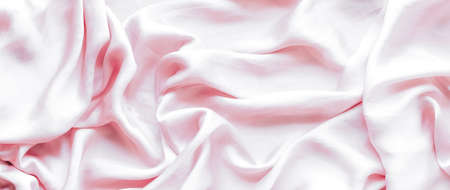 Elegant fabric texture, abstract backdrop and modern pastel colours concept - Pink soft silk waves, flatlay backgroundの写真素材
