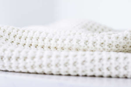 Knitwear, fabric textures and handmade items concept - Warm knitted clothes, soft and whiteの写真素材