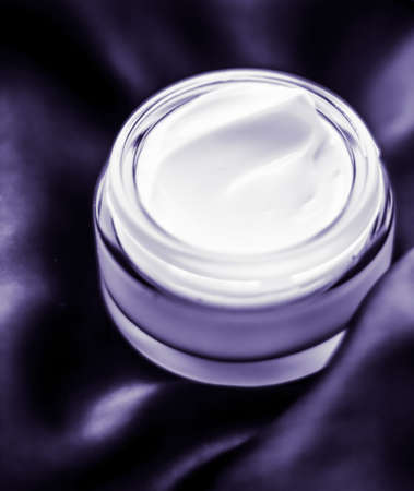 Cosmetology, spa cosmetics and anti-age product concept - Luxury moisturizing face cream with lavender scent on violet silk, skincare beautyの写真素材