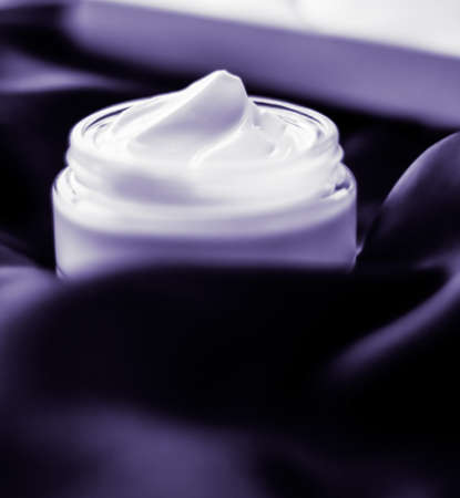 Cosmetology, spa cosmetics and anti-age product concept - Luxury moisturizing face cream with lavender scent on violet silk, skincare beautyの写真素材