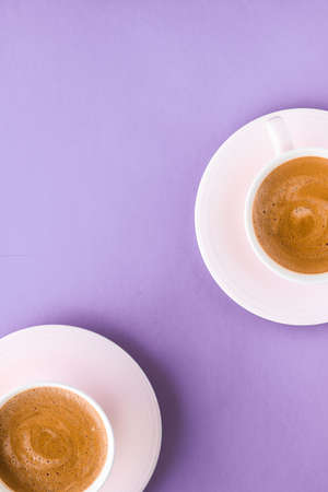 Breakfast, drinks and cafe menu concept - Coffee cup on purple background, top view flatlayの写真素材