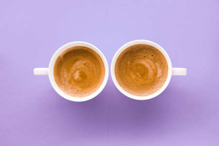 Breakfast, drinks and cafe menu concept - Coffee cup on purple background, top view flatlayの写真素材