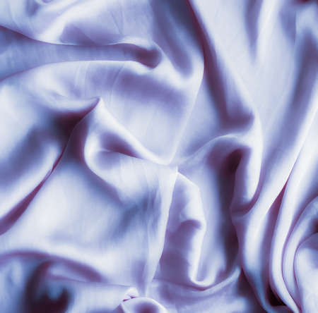 Elegant fabric texture, abstract backdrop and modern pastel colours concept - Purple soft silk waves, flatlay backgroundの写真素材