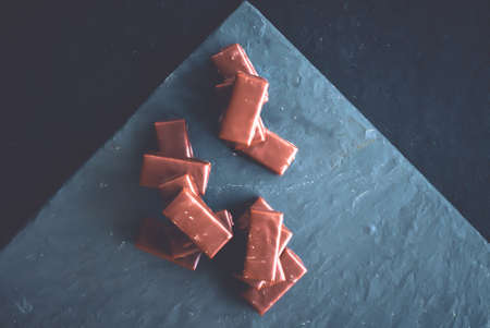 Dessert, confectionery and gluten-free organic food concept - Sweet swiss chocolate candies on a...