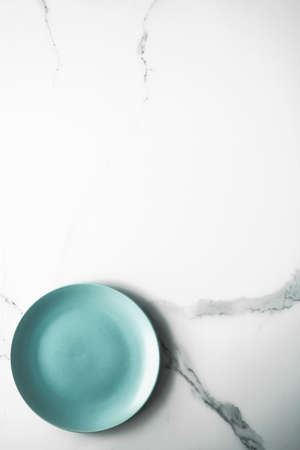 Turquoise empty plate on marble, flatlay - stylish tableware, table decor and food menu concept. Serve the perfect dishの写真素材