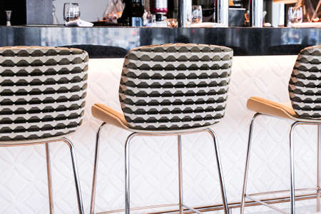 Interior design, furniture decor and nightlife concept - Modern bar stool in a luxury restaurant