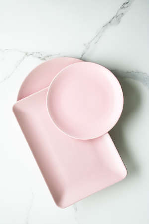 Pink empty plate on marble, flatlay - stylish tableware, table decor and food menu concept. Serve the perfect dishの写真素材