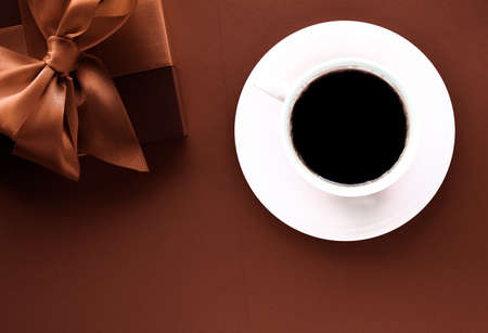 Romantic present, cafe backdrop and drink concept - Coffee cup and luxury gift box flatlay backgroundの写真素材