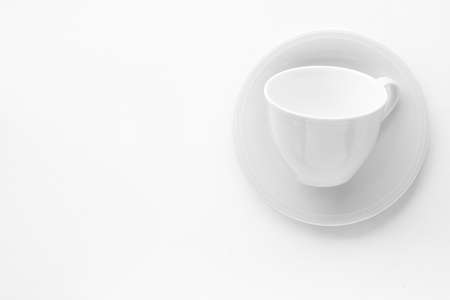 Kitchen, dishware design and drink concept - Empty cup and saucer mockup on white background, flatlayの写真素材