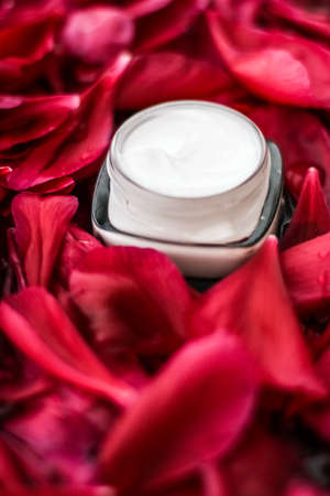 Clean beauty, cosmetic products and luxury body care concept - Sensitive skincare moisturizer cream on red flower petals and water background, natural science for skinの写真素材