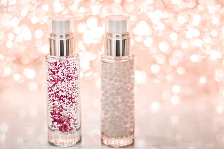 Cosmetic branding, blank label and glamour present concept - Holiday make-up base gel, serum emulsion, lotion bottle and rose gold glitter, luxury skin and body care cosmetics for beauty brand adsの写真素材
