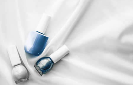 Cosmetic branding, salon and glamour concept - Nail polish bottles on silk background, french manicure products and nailpolish make-up cosmetics for luxury beauty brand and holiday flatlay art designの写真素材
