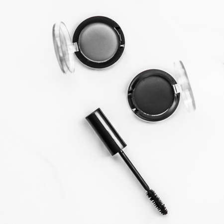 Cosmetic branding, blog and girly concept - Eyeshadows, black liner and mascara on marble background, eye shadows cosmetics as glamour make-up products for luxury beauty brand, holiday flatlay designの写真素材