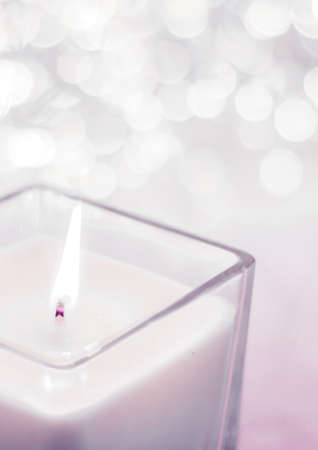 Festive decoration, branding and aromatherapy spa concept - Blush pink aromatic candle on Christmas and New Years glitter background, Valentines Day luxury home decor and holiday season brand designの写真素材