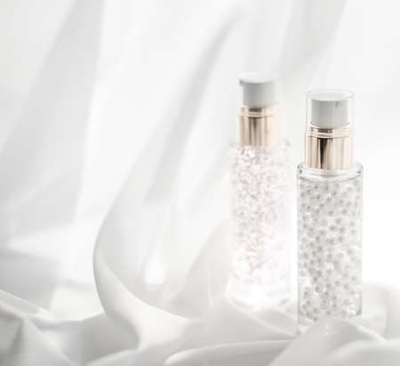 Cosmetic branding, moisture and spa concept - Skincare serum and make-up primer gel bottle,...