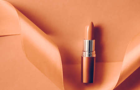 Cosmetic branding, glamour lip gloss and shopping sale concept - Luxury lipstick and silk ribbon on...