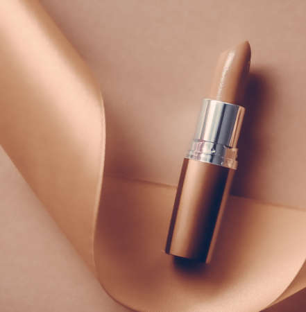 Cosmetic branding, glamour lip gloss and shopping sale concept - Luxury lipstick and silk ribbon on...