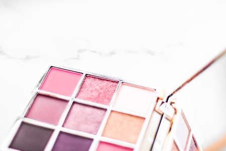Cosmetic branding, fashion blog and glamour set concept - Eye shadow palette swatches on marble...