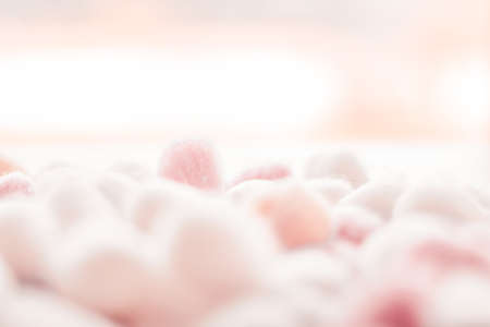 Cosmetology, branding and cleanliness concept - Organic cotton balls background for morning routine, spa cosmetics, hygiene and natural skincare beauty brand product as healthcare and medical designの写真素材