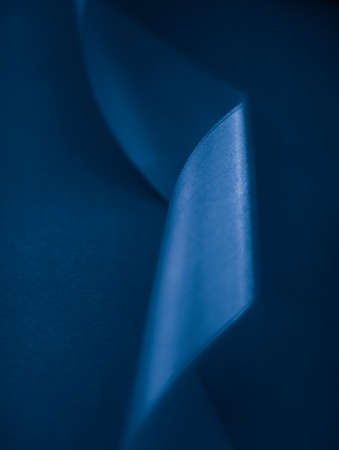 Branding, holidays and luxe brands concept - Abstract silk ribbon on royal blue background, exclusive luxury brand design for holiday sale product promotion and glamour art invitation card backdropの写真素材