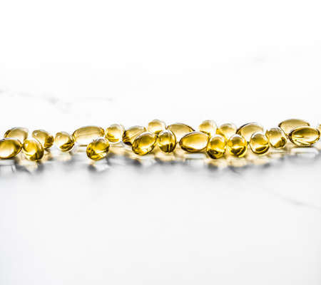 Pharmaceutical, branding and science concept -  Vitamin D and golden Omega 3 pills for healthy diet...